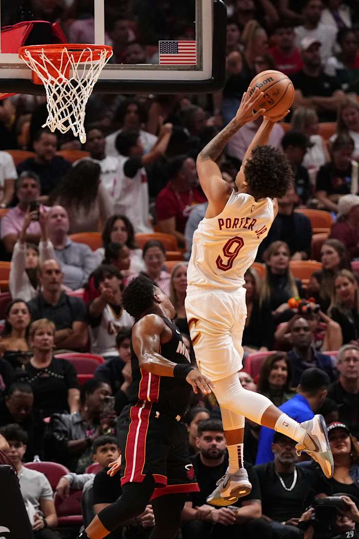 Dec 8, 2023; Miami, Florida, USA; Cleveland Cavaliers guard Craig Porter (9) shoots over Miami Heat guard Kyle Lowry (7) during the first half at Kaseya Center.